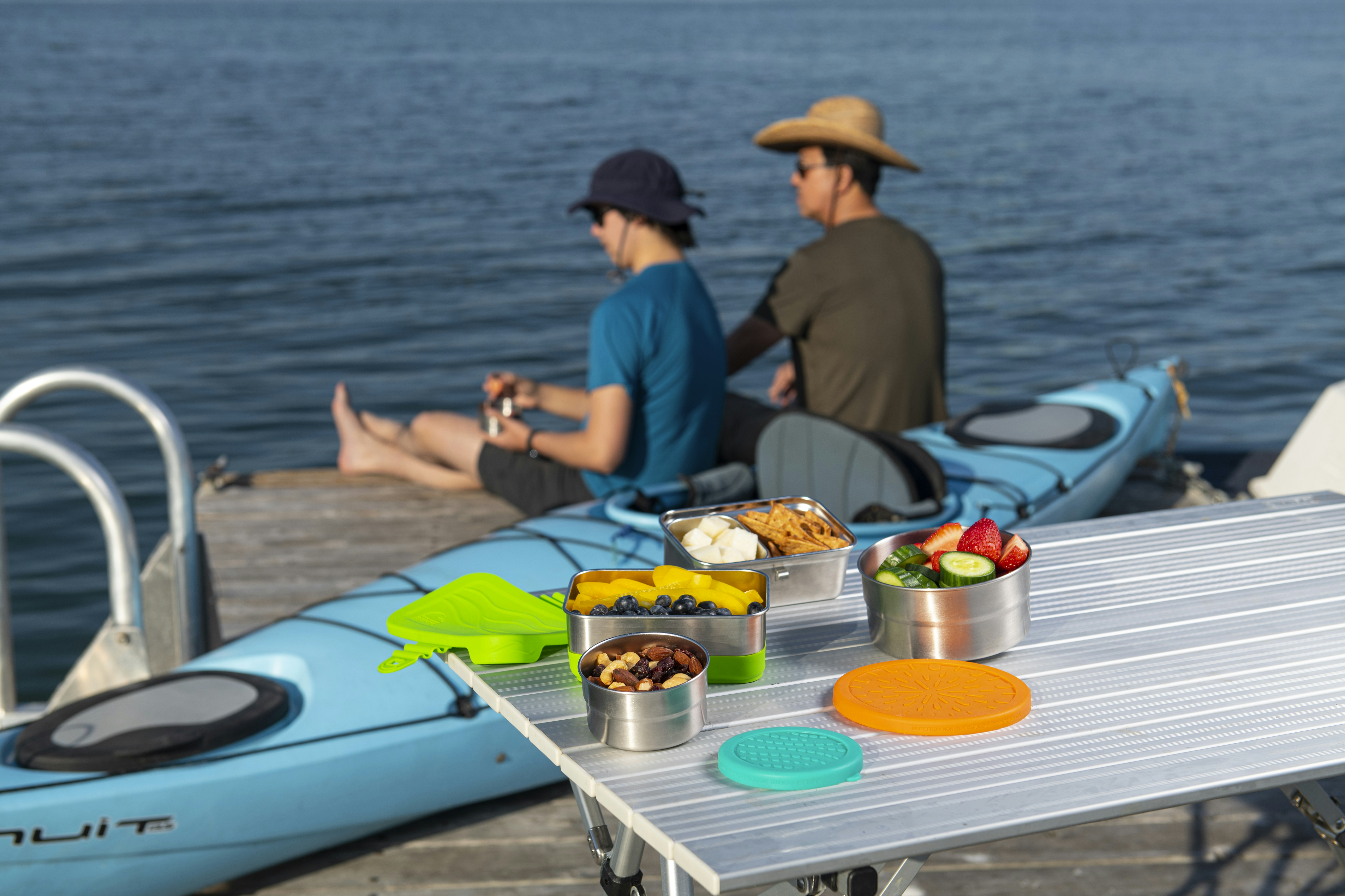 a couple of people sitting on top of a boat