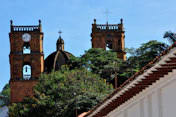a couple of towers with a clock on each of them