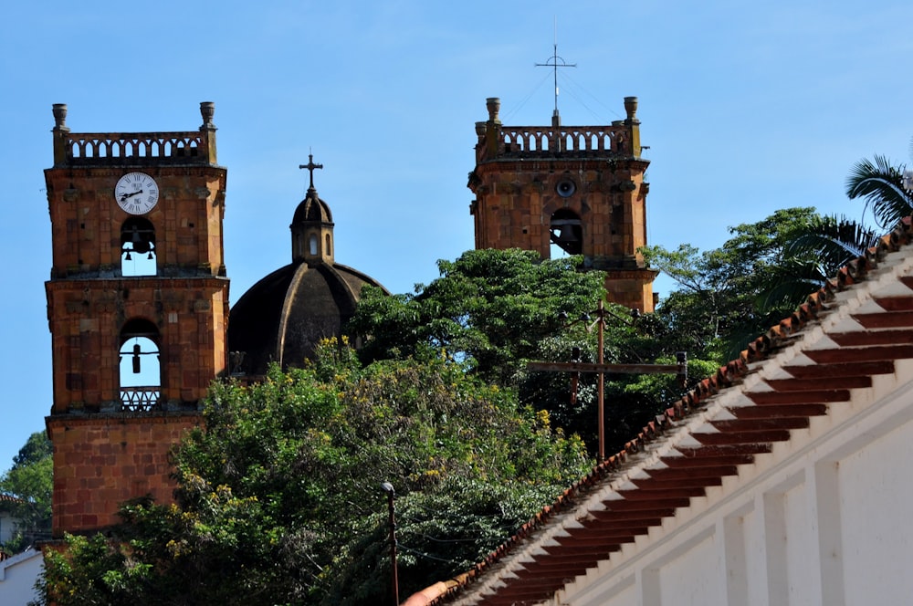 a couple of towers with a clock on each of them