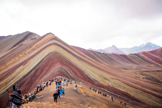 a group of people standing on top of a mountain