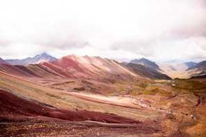 a group of people hiking up a mountain