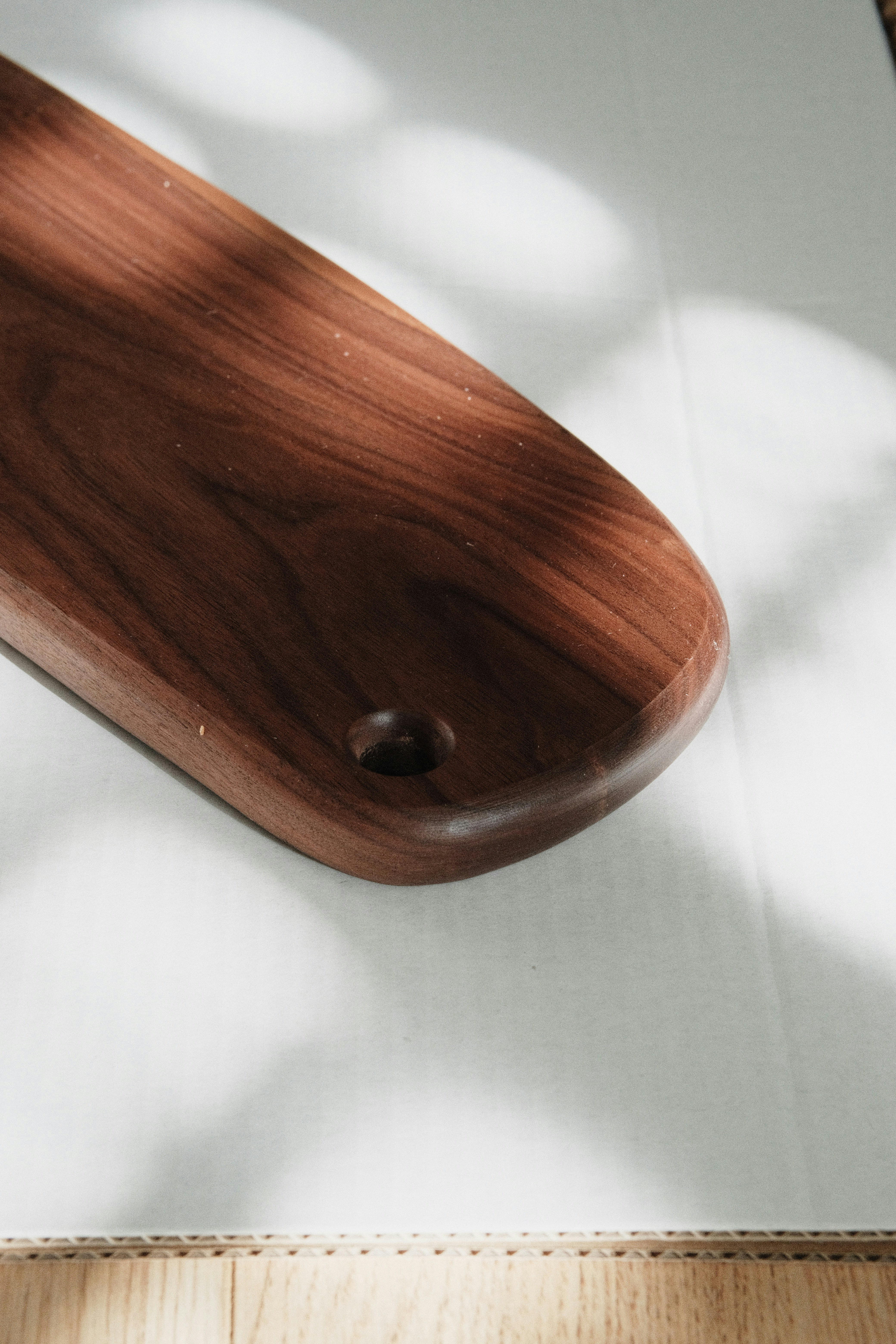 a close up of a wooden object on a table