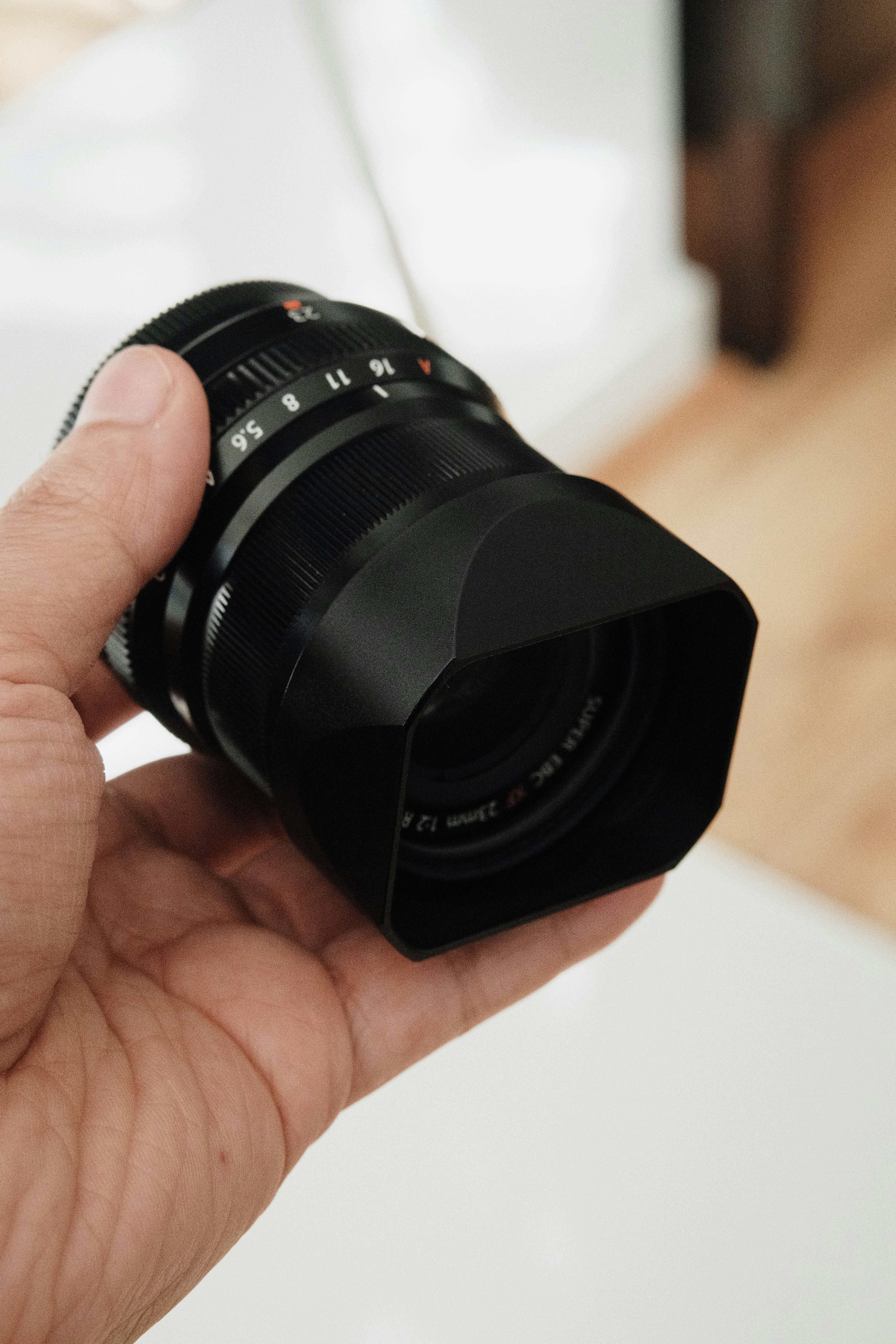 a person holding a camera in their hand