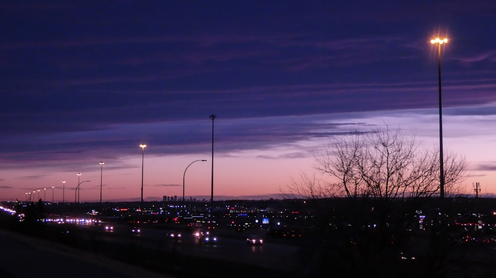 a night time view of a parking lot and street lights