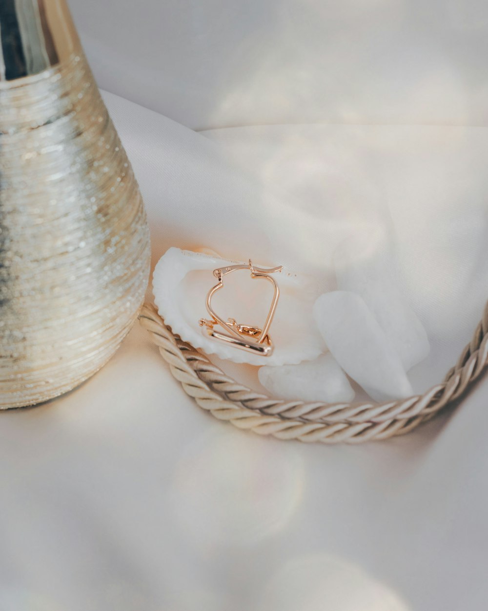 a close up of a vase with a ring on it