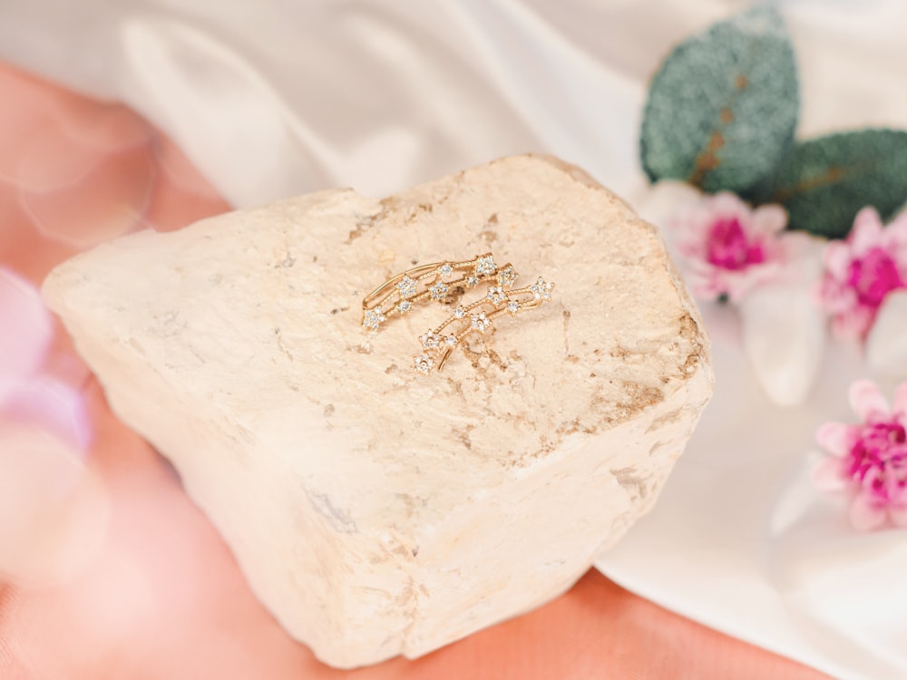 a close up of a rock with a ring on it