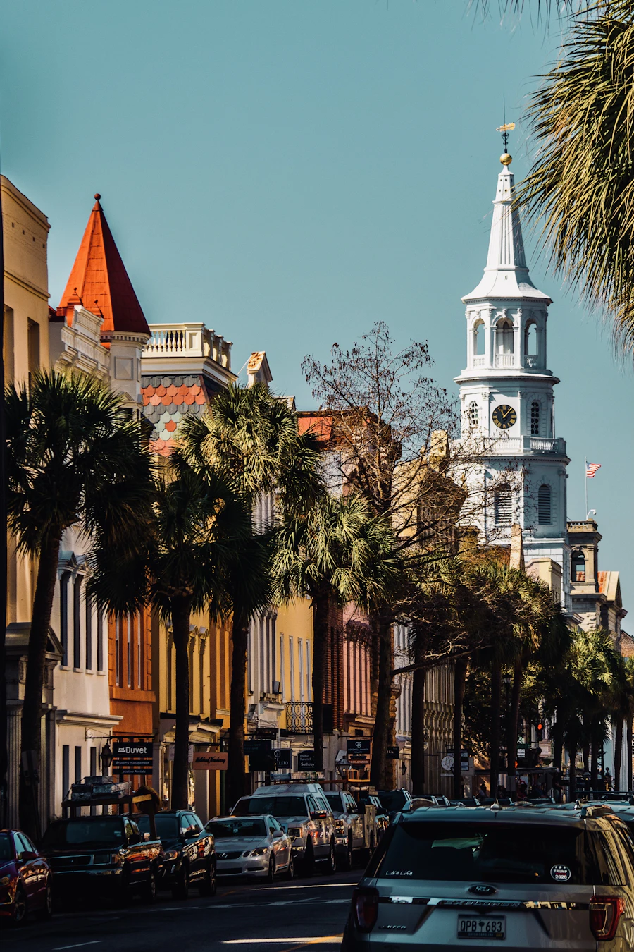 A white church steeple above Charleston rooftops