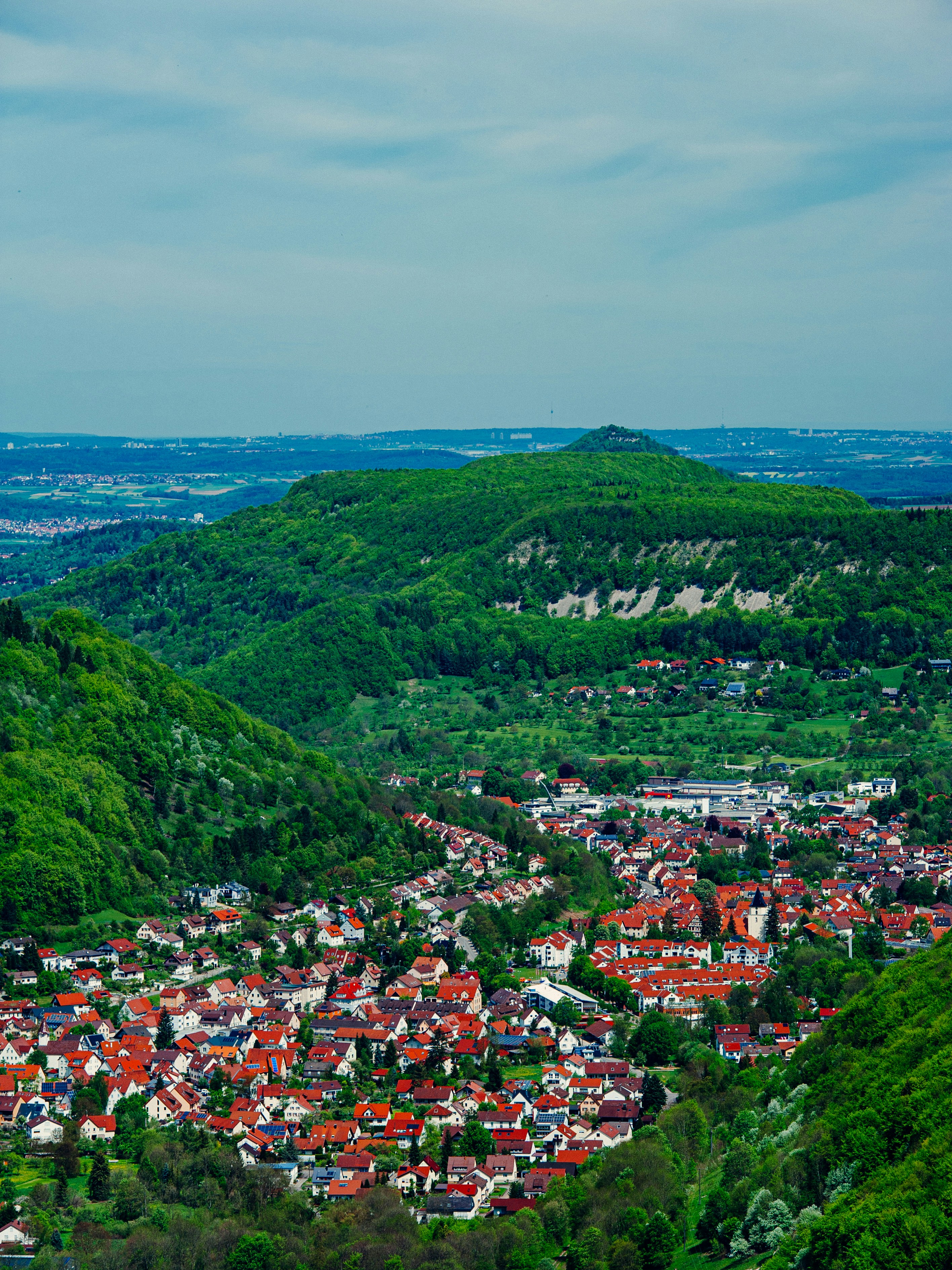 a view of a small town in the middle of a valley