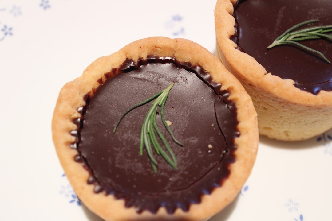 a couple of cookies that are sitting on a table, Chocolate tart