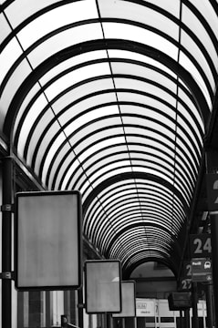 a black and white photo of a train station