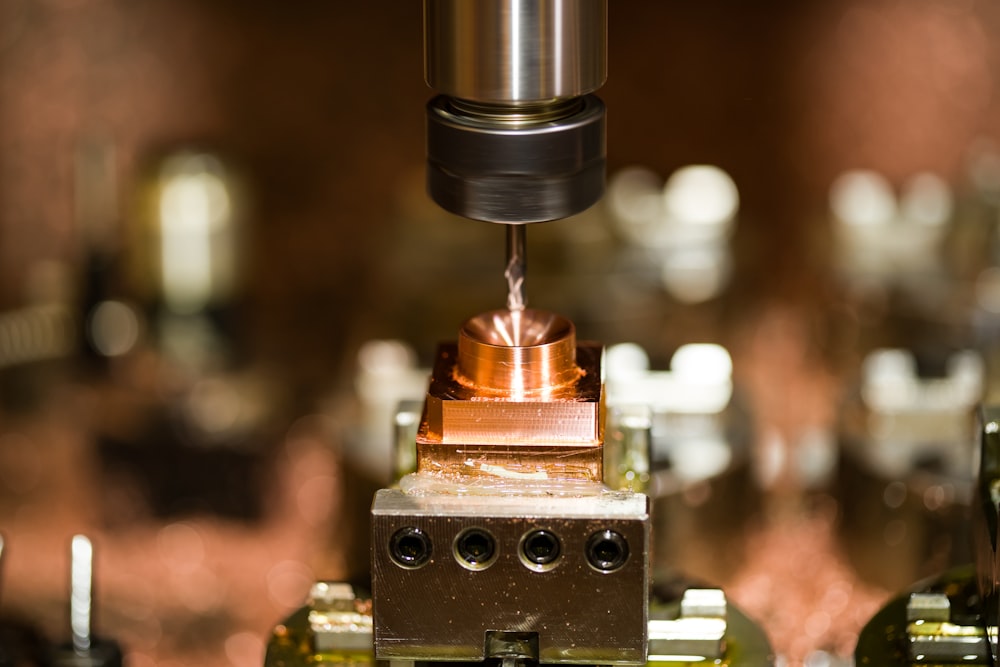 a close up of a machine with a piece of metal on it