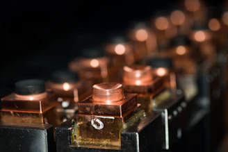 a row of lit candles sitting on top of a table