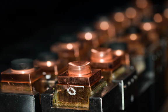 a row of lit candles sitting on top of a table