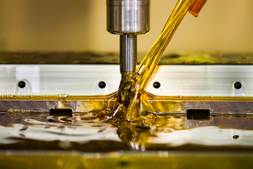 a close up of a machine cutting a piece of metal