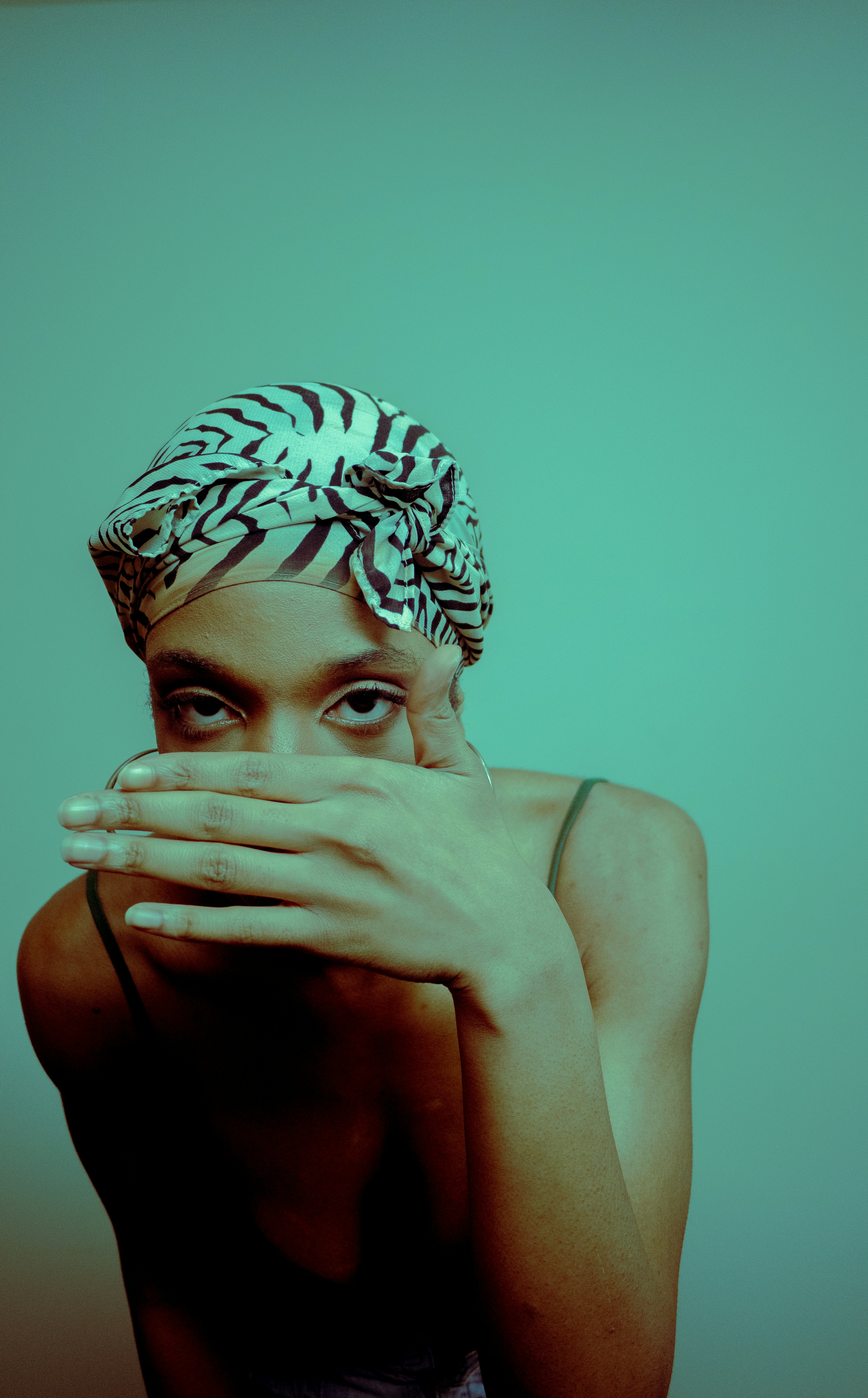 a woman covering her face with her hands