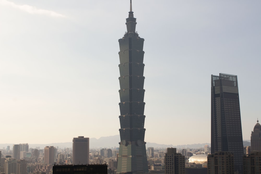 a very tall building towering over a city