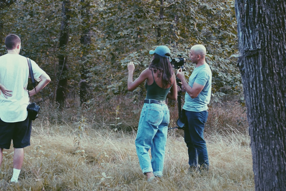 a group of people standing in a field