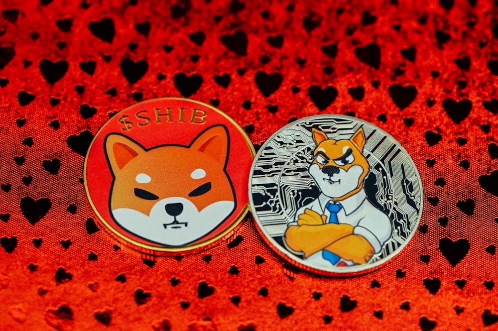 a couple of badges sitting on top of a table