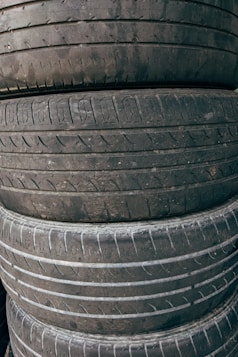 a pile of old tires stacked on top of each other