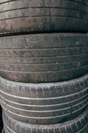 a pile of old tires stacked on top of each other