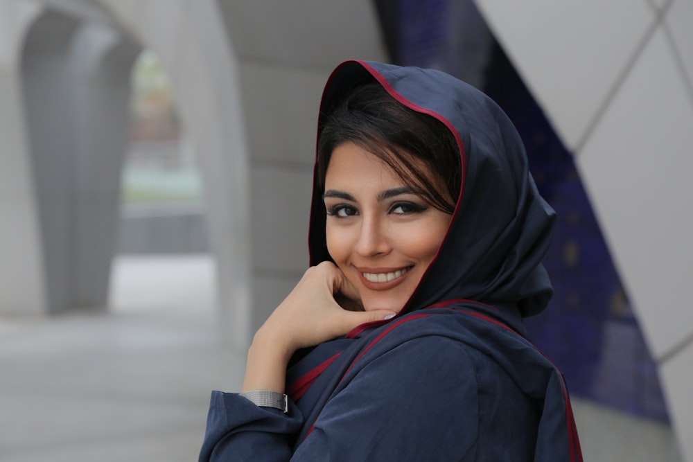 a woman wearing a blue and red hijab