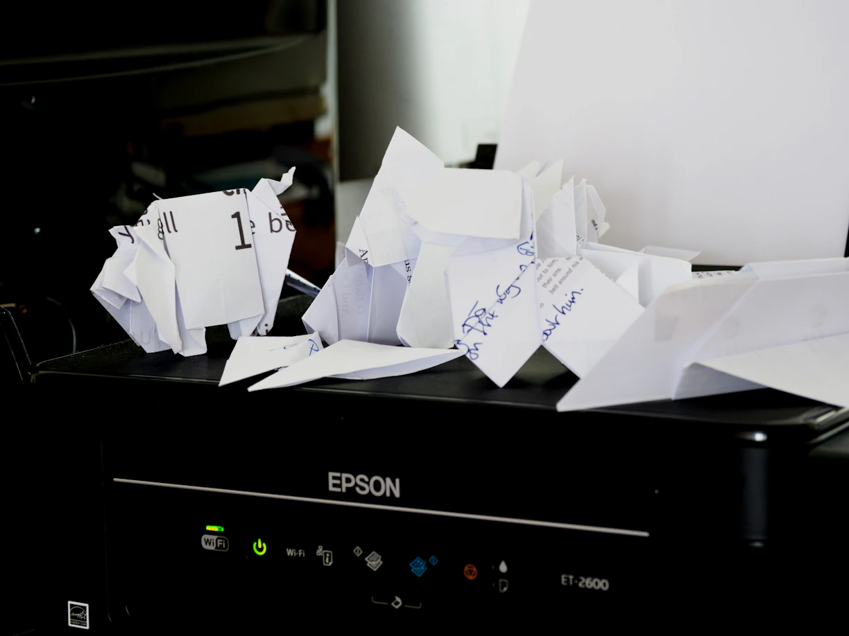 a pile of papers sitting on top of a black box