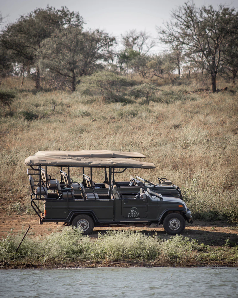 Safari 4x4 vehicle parked in a grass field