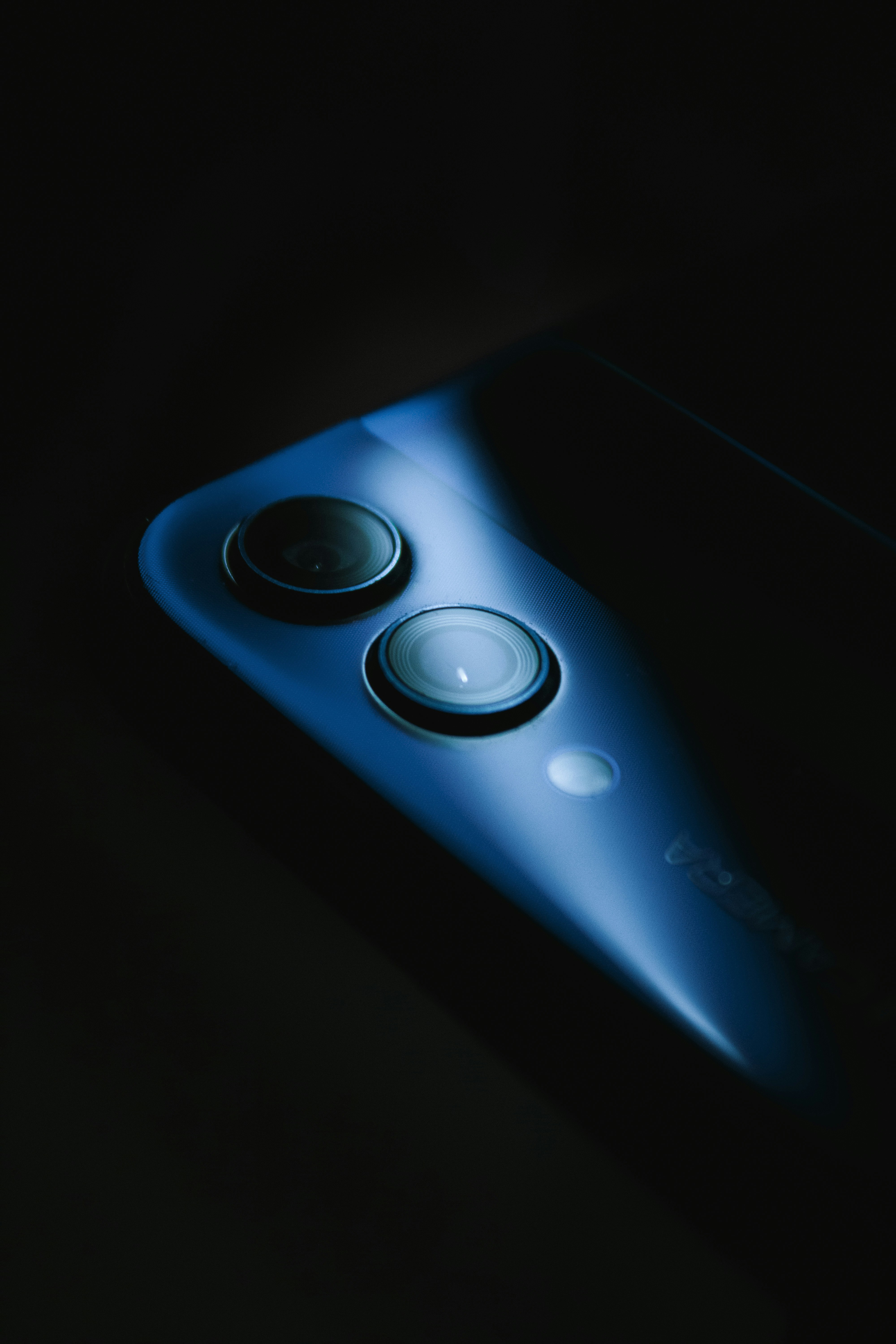 a close up of a cell phone in the dark