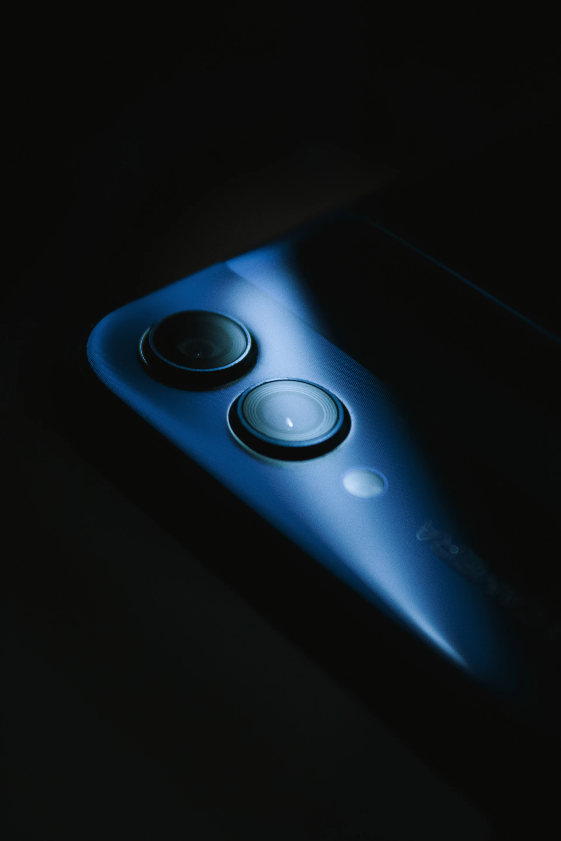 a close up of a cell phone in the dark