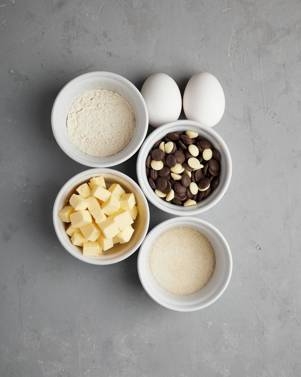 four bowls filled with different types of food