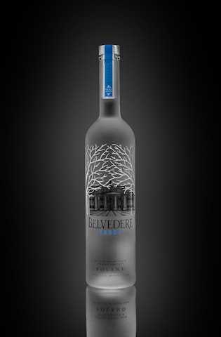a bottle of belvedere vodka on a black background