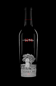 a bottle of silver oak wine on a black background