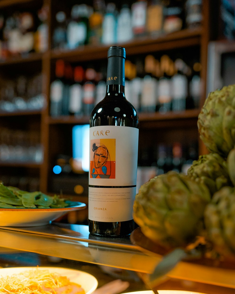 a bottle of wine sitting on top of a table