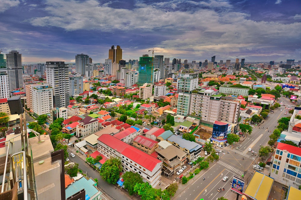 an aerial view of a city with tall buildings