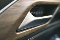 Close-up of handcrafted wood and metal details on a Terratrek camper interior.