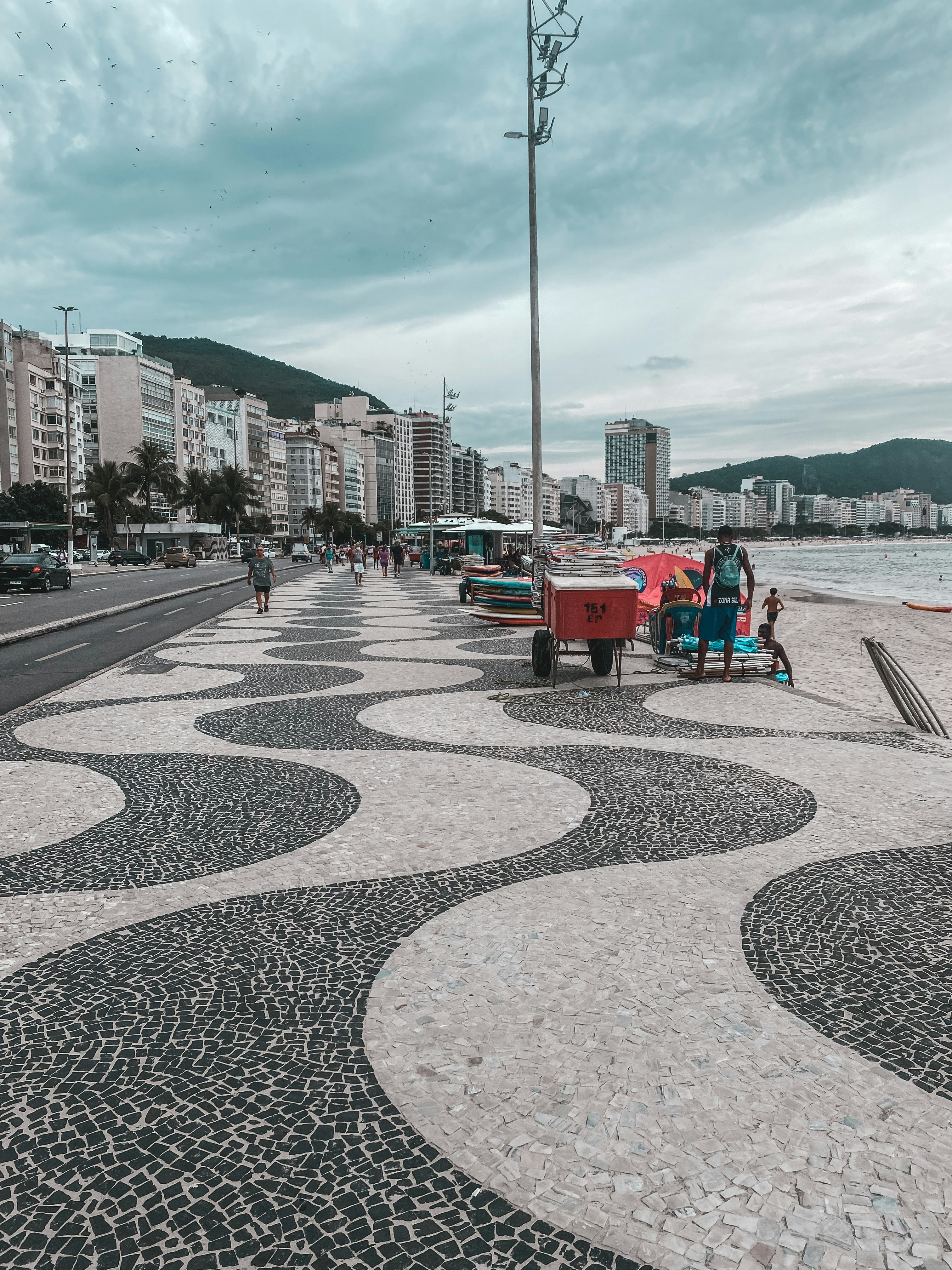 Beach promenade with naturist guests and Mediterranean sea