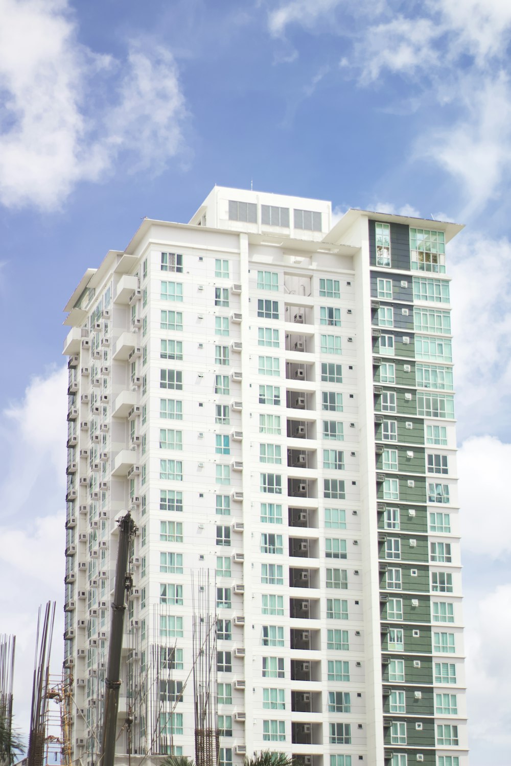 a very tall white building with lots of windows