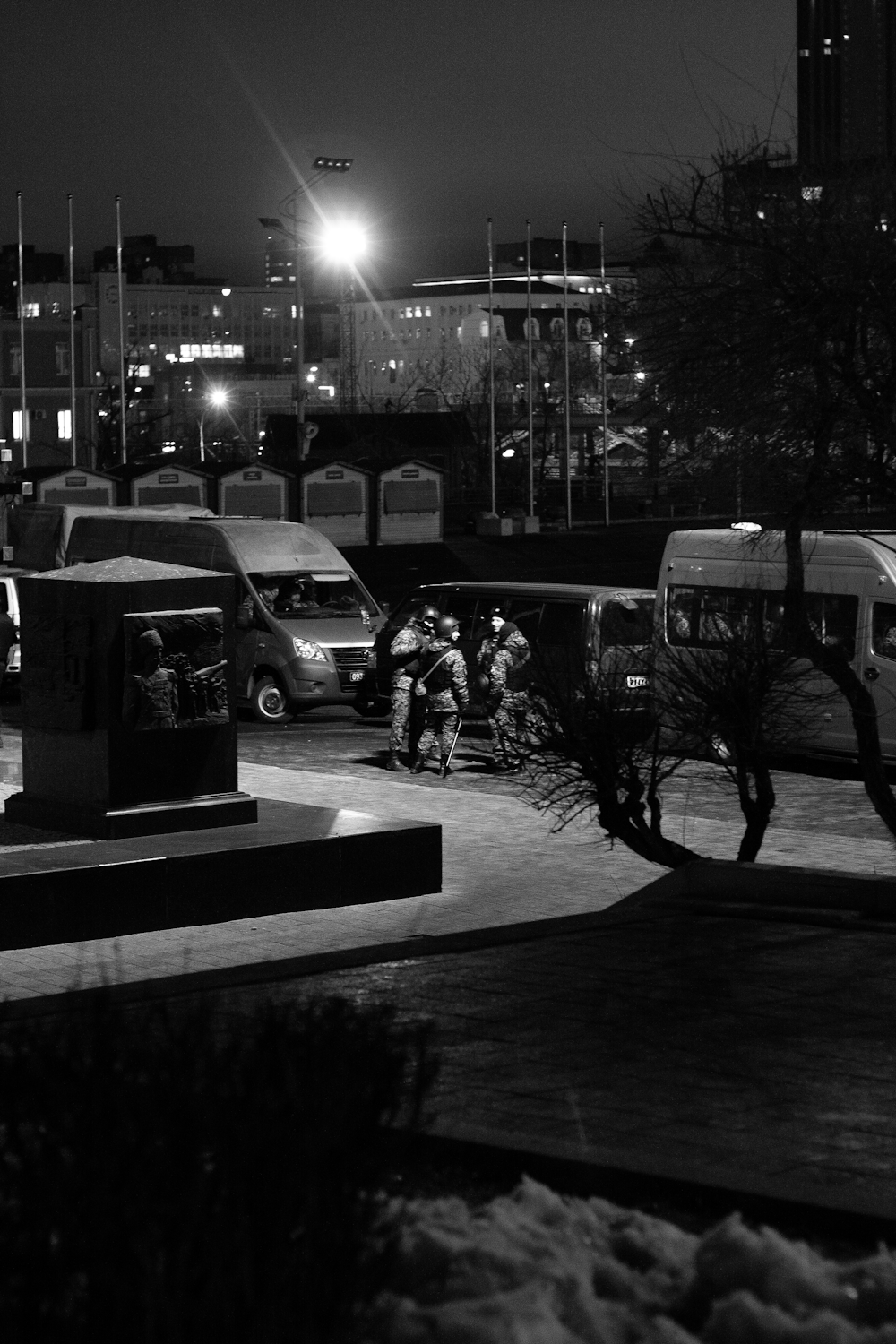 a black and white photo of a city at night