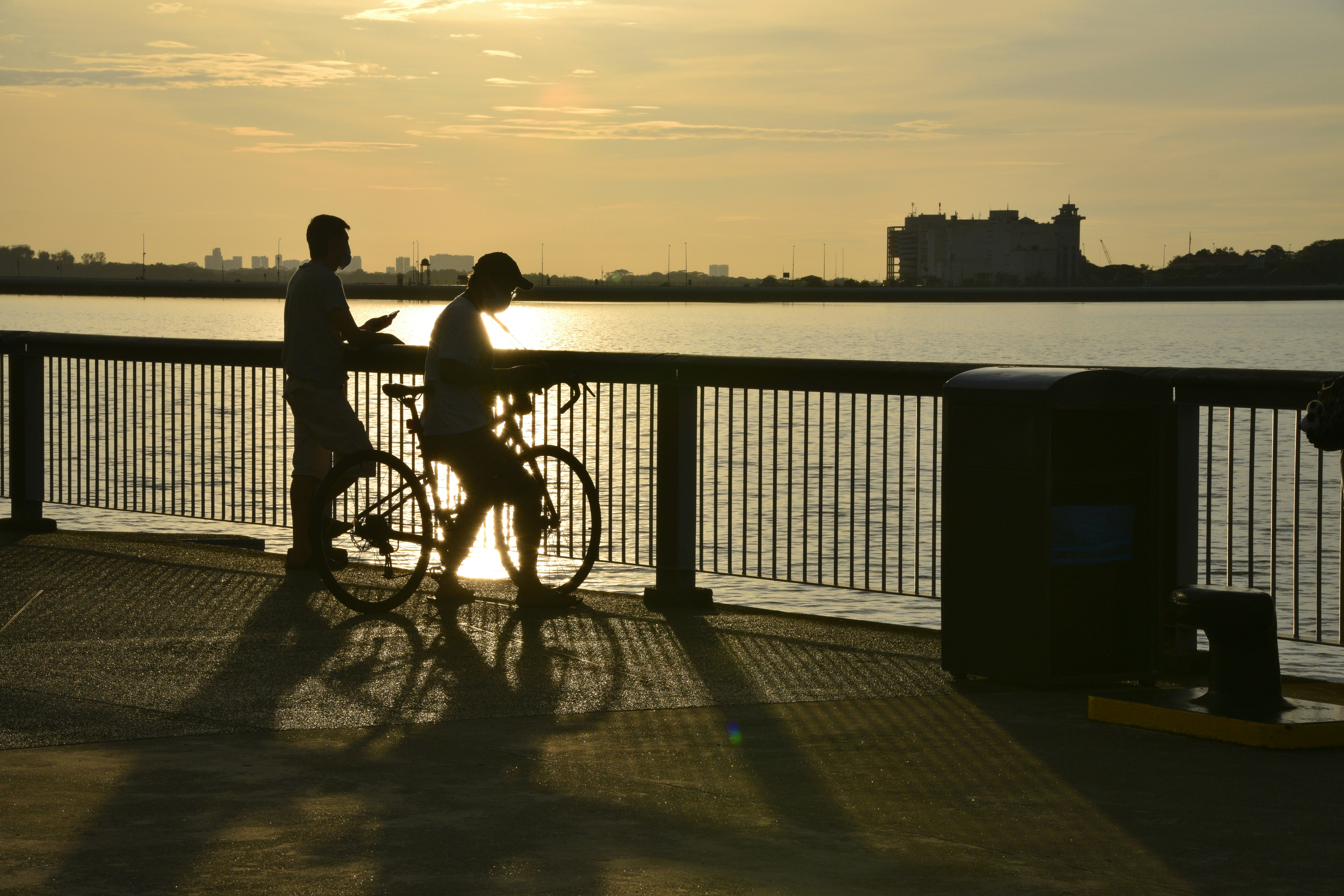 Cyclist along a riverside path