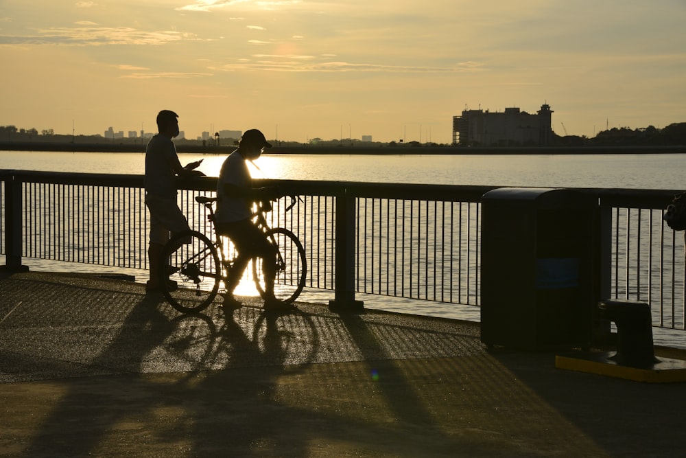 a couple of people that are on a bike