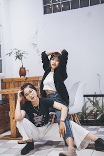 a man and a woman sitting on a chair