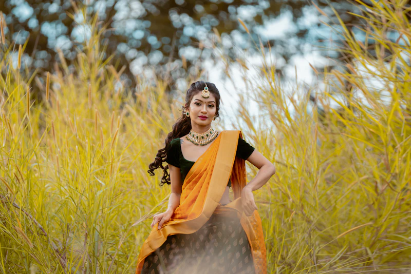 woman standing in tall grass with natural confidence