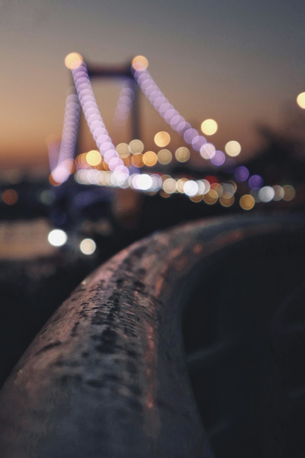 a blurry photo of a bridge at night