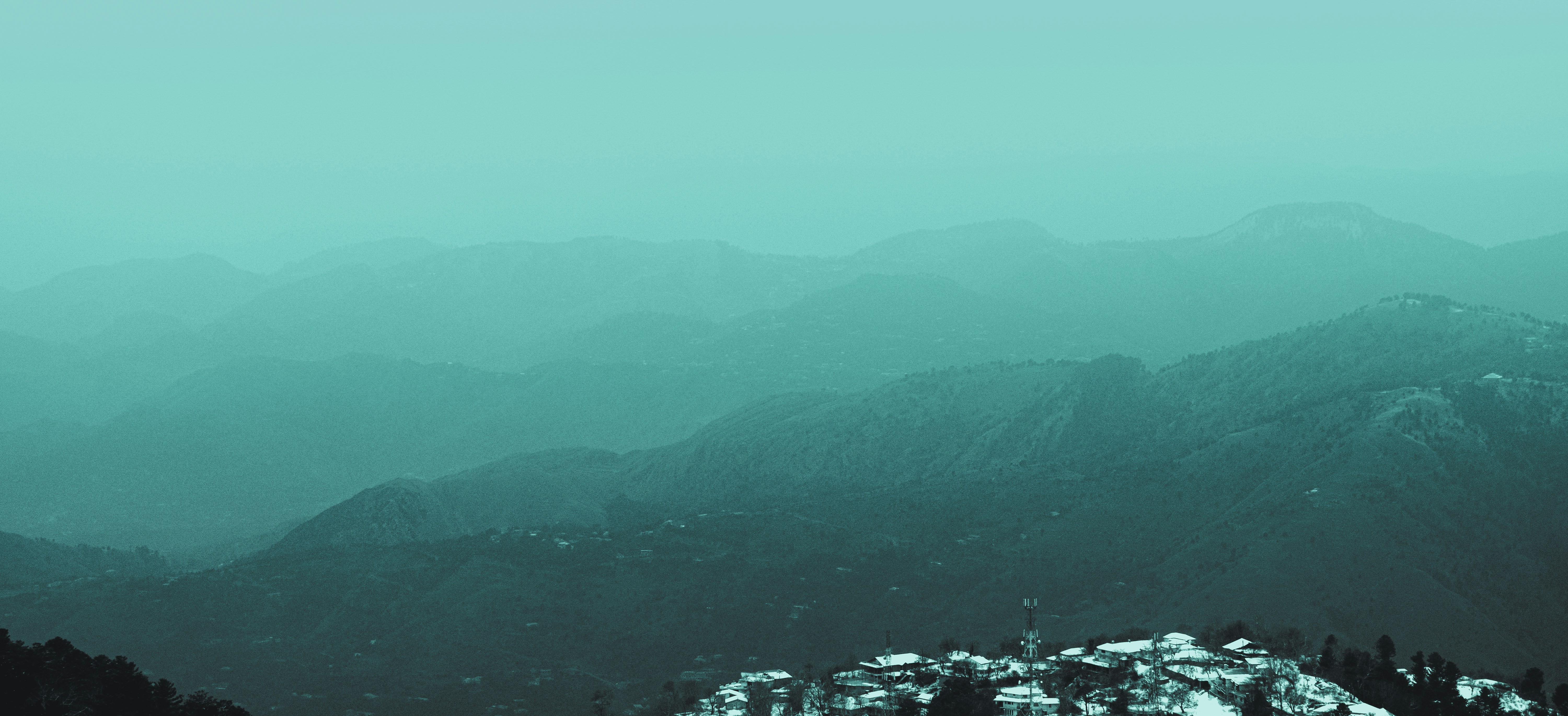 a view of a mountain range covered in snow