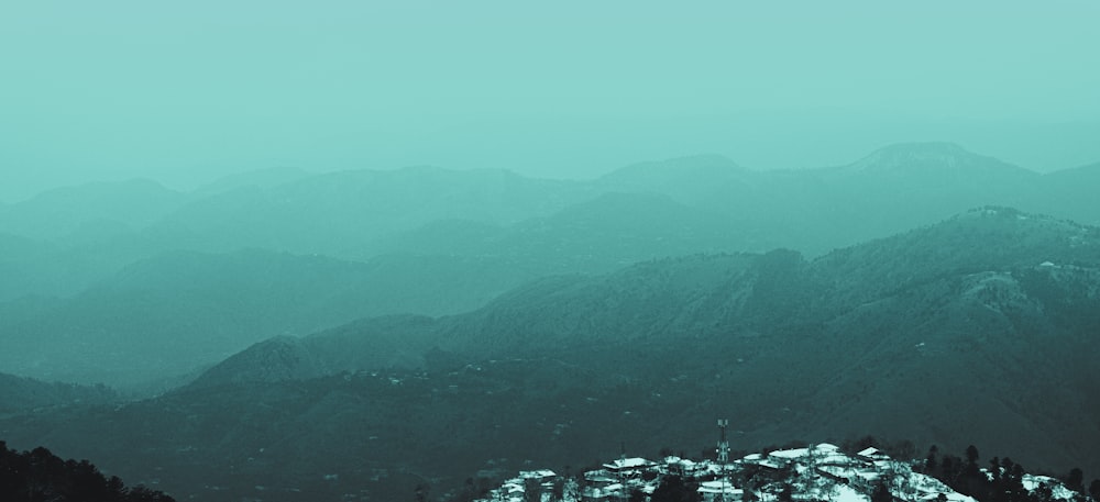 a view of a mountain range covered in snow