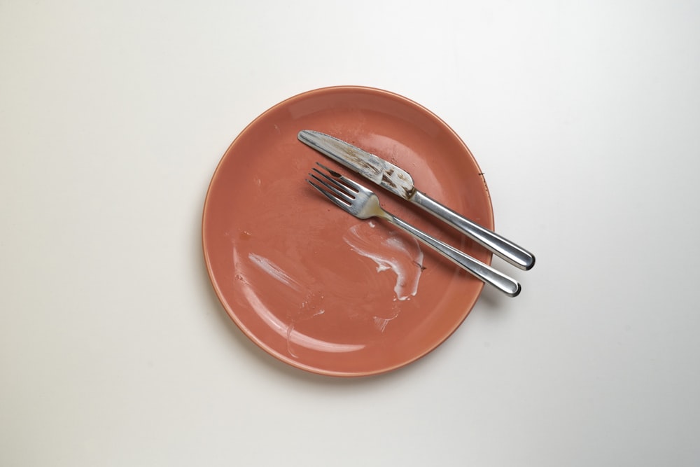a plate with a fork and knife on it