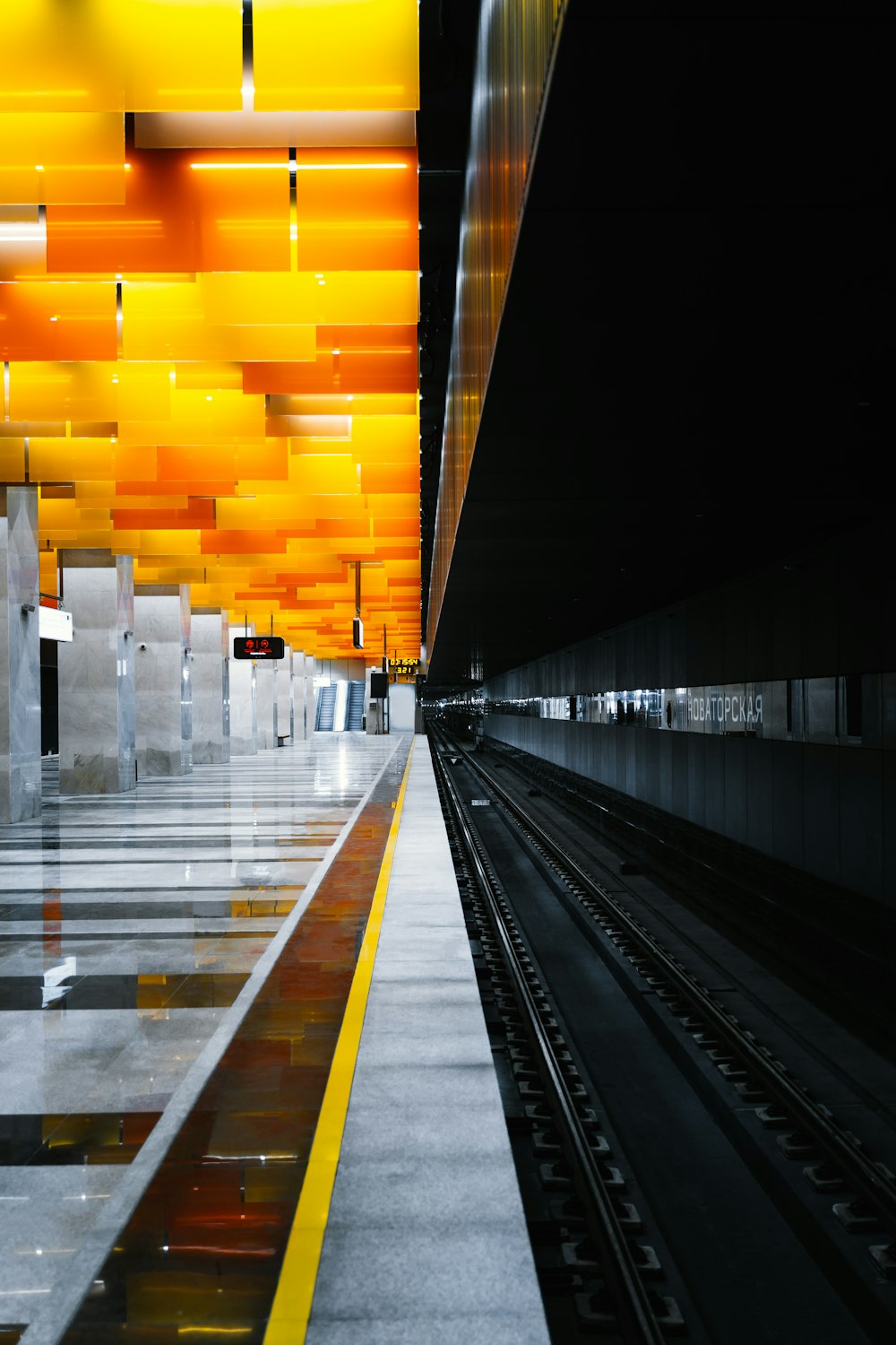 a train station with a train on the tracks