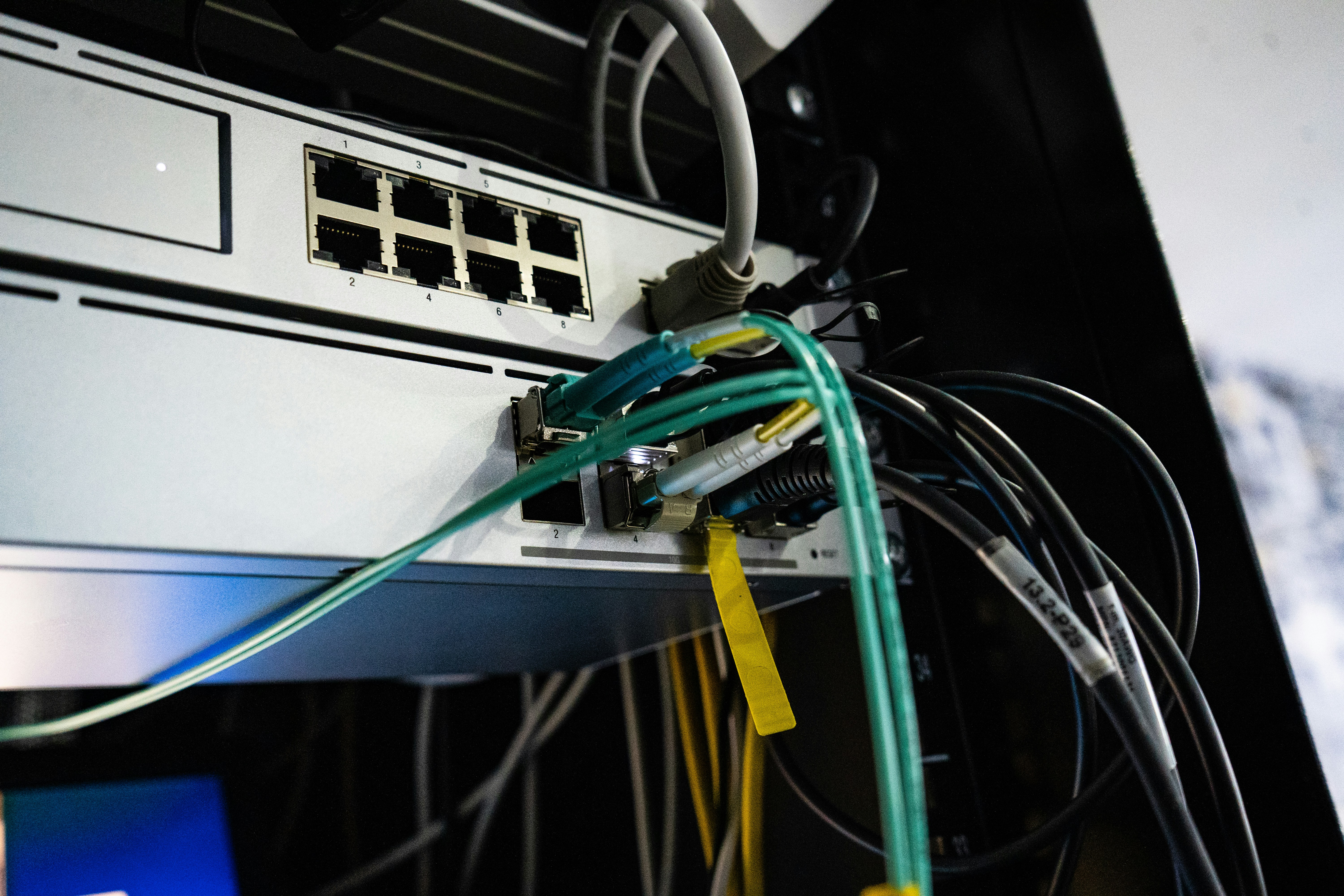 Close-up of network switch with ethernet cables connected for office network