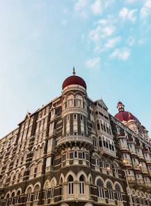 a large building with a red dome on top of it