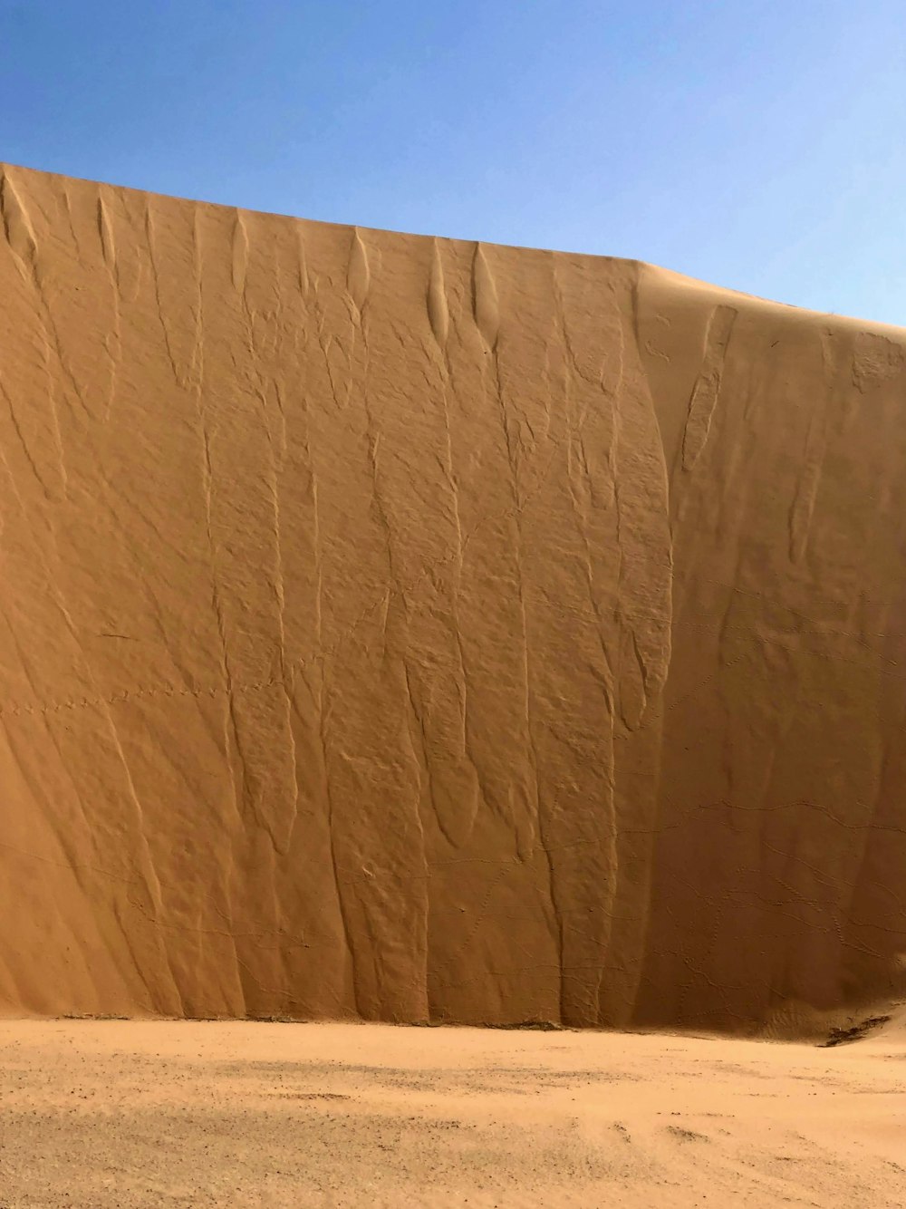 a large sand dune in the middle of the desert